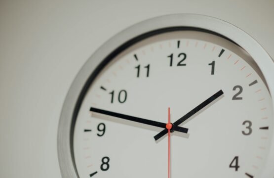 round silver analog wall clock displaying 1:48 time