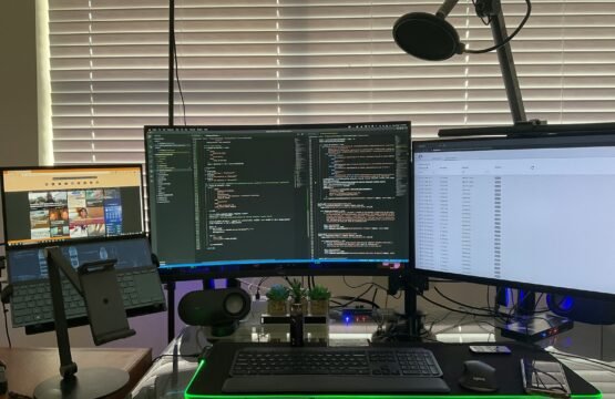 a desk with a couple of computers